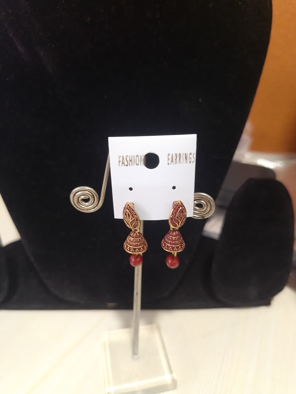 gold-polished Jhumka earrings with red bead detailing - Image 2