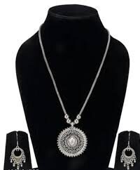 German Silver Necklace Set with a Round Pendant and Ghunghru Beads.