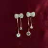 Fly long earrings.
