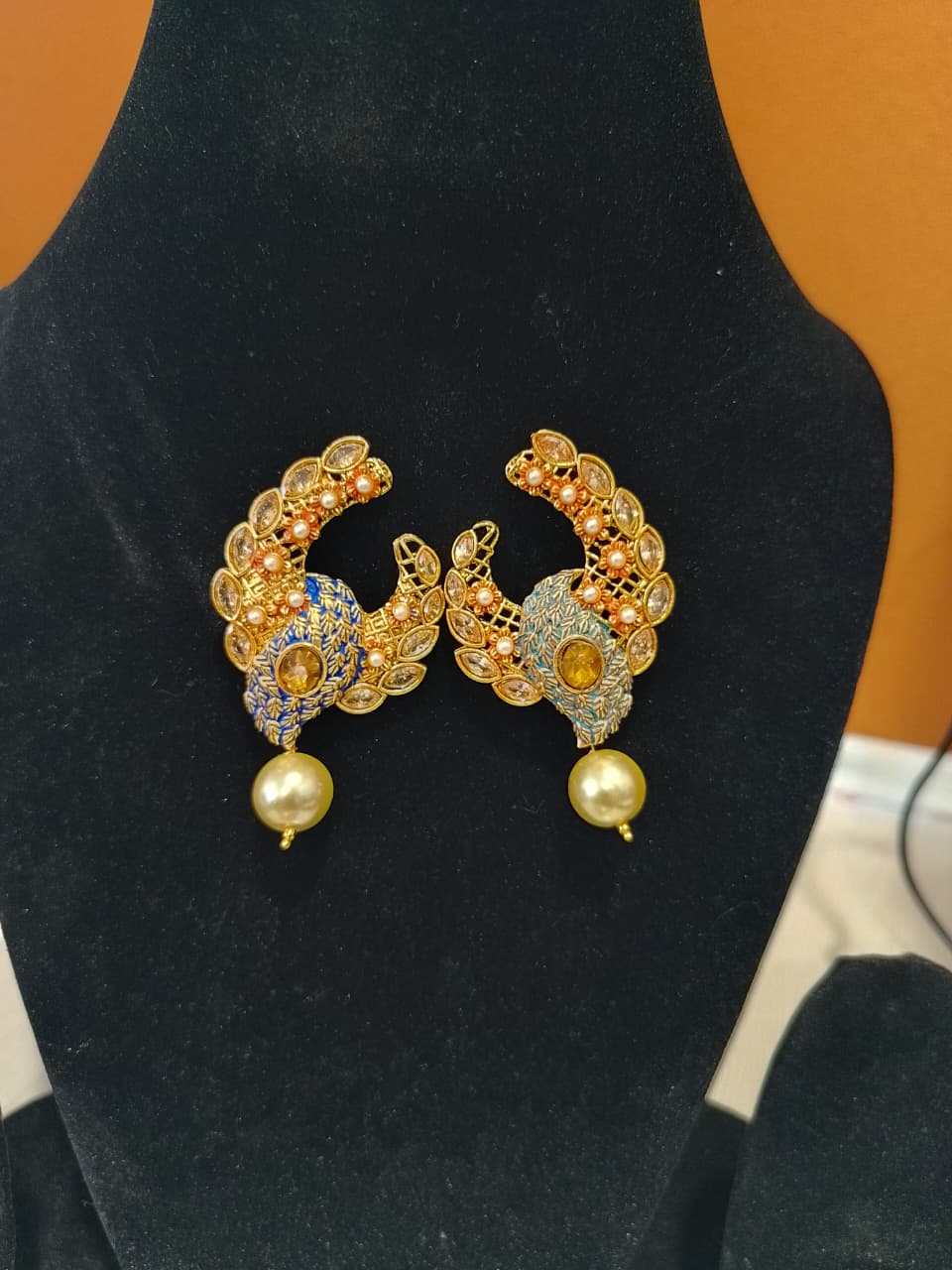 These are a pair of Indian ethnic earrings with a crescent moon design, - Image 2